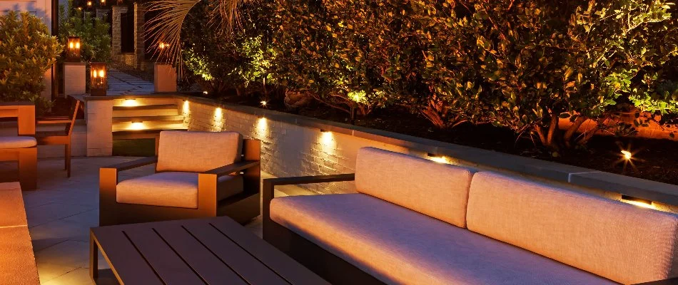 Planter beds and outdoor steps in Cary, NC, with outdoor lighting.