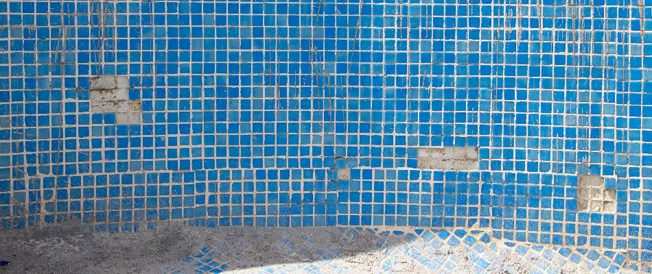 Pool in Cary, NC, with damaged tiles.