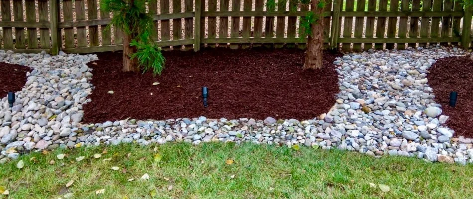 Dry creek bed running through a mulch bed in Holly Springs, NC.