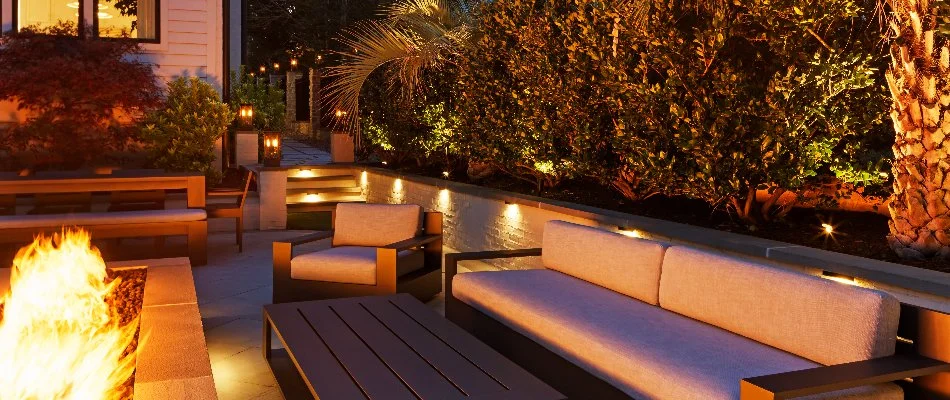 Lighting along a wall and plantings near seating in Wendell, NC.