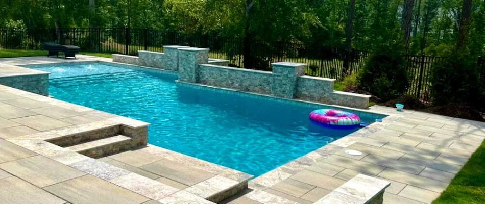 Modern swimming pool with a paver patio in Carrboro, NC.