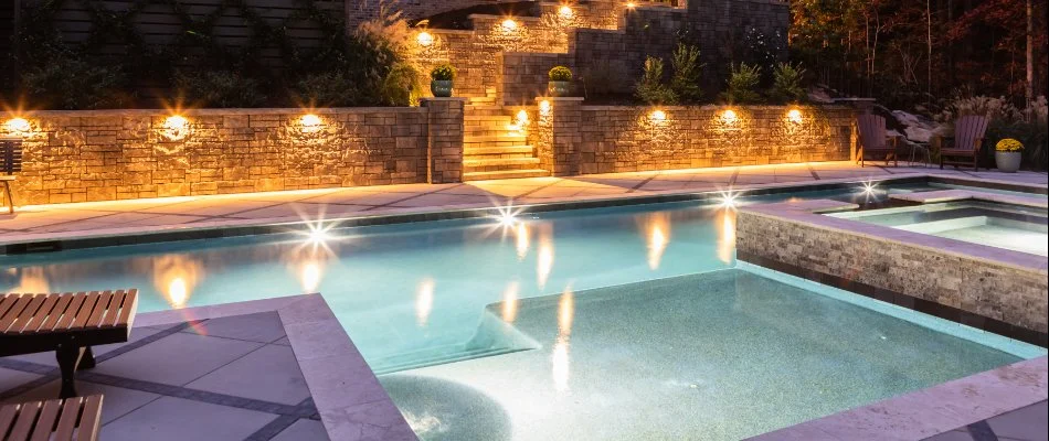 Swimming pool with lighting on a property in Garner, NC.