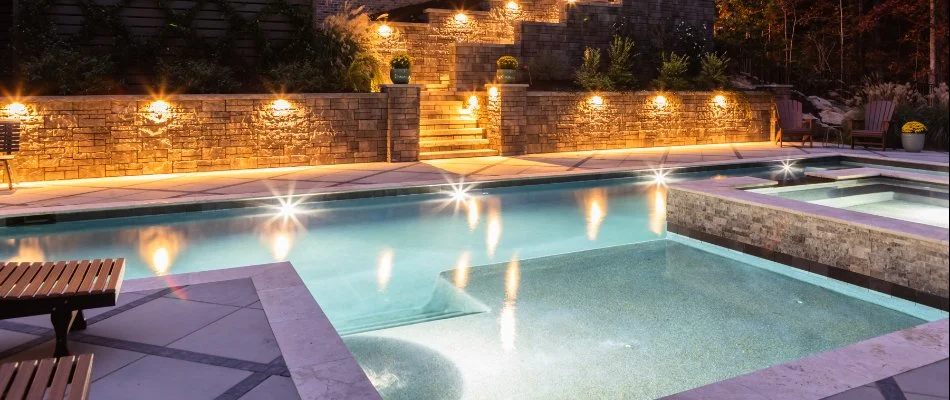 Swimming pool and outdoor lights on a property in Rolesville, NC.